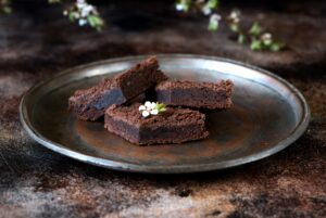 Chocolate brownie cake on a copper plate